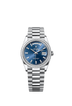 The Oyster Perpetual Day-Date 36 in platinum, with a bright blue, diamond-set dial, diamond-set bezel and a President bracelet.